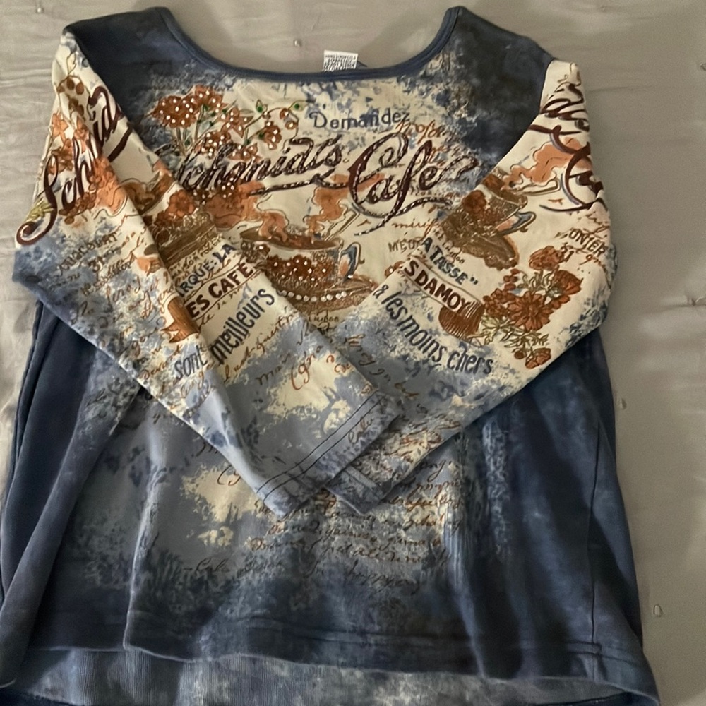 It is a old long sleeve tee and vintage from the brand Take two.